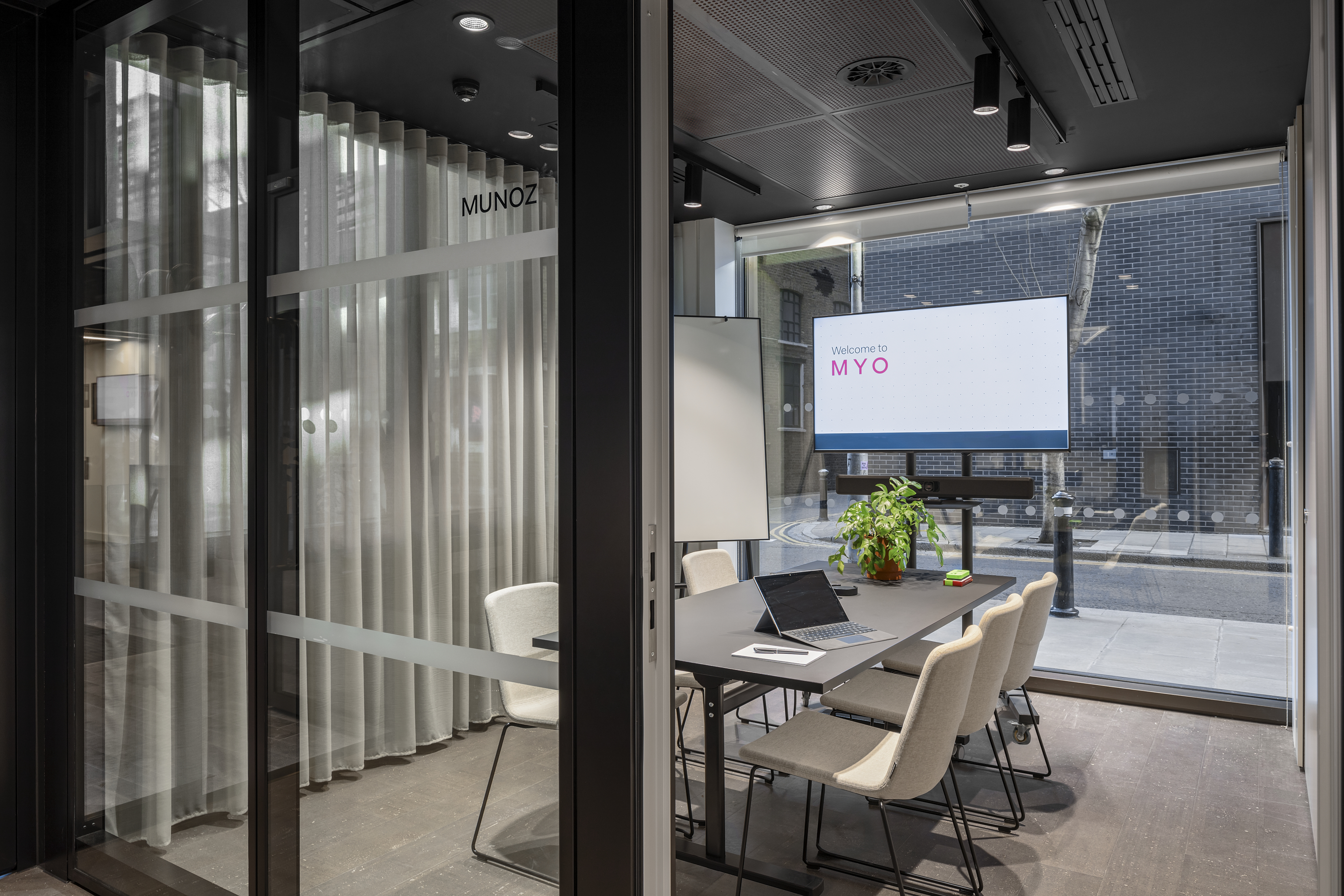 Glass-fronted meeting room at MYO Bankside featuring presentation facilities and collaborative workspace.
