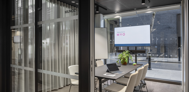 Glass-fronted meeting room at MYO Bankside featuring presentation facilities and collaborative workspace.
