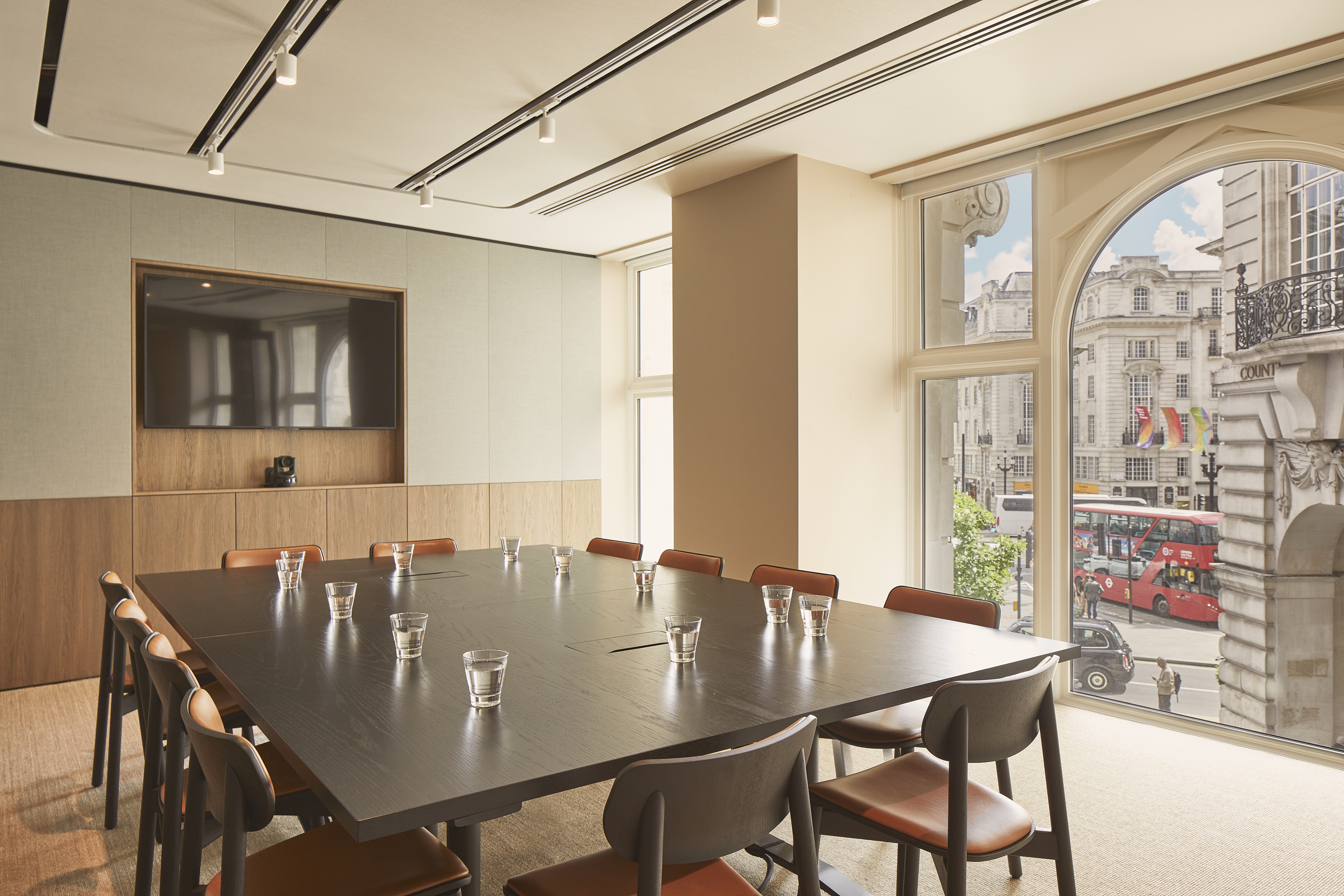 Conference room with large table that seats up to 12 people.