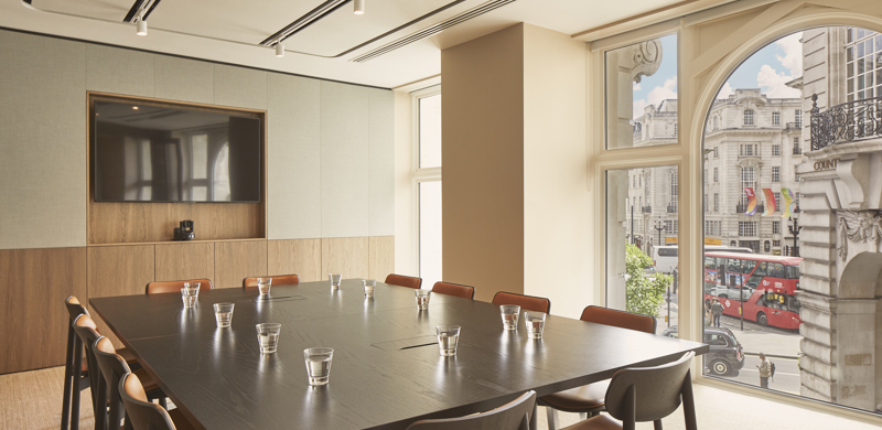 Conference room with large table that seats up to 12 people.