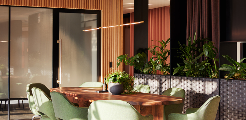 Collaborative meeting area at MYO Liverpool Street featuring a shared wooden table, comfortable seating and biophilic design elements within a contemporary workspace.