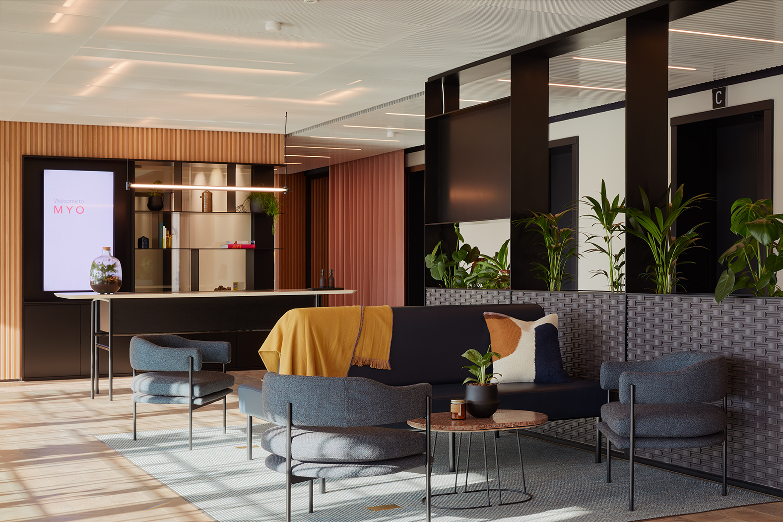Contemporary lounge area at MYO Liverpool Street featuring comfortable seating, biophilic design elements and flexible spaces for informal meetings and collaboration.