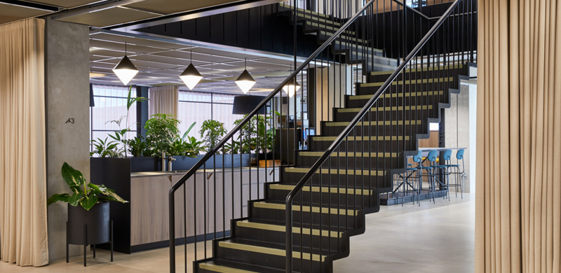 A modern, sleek staircase in the centre of MYO Victoria Street reception