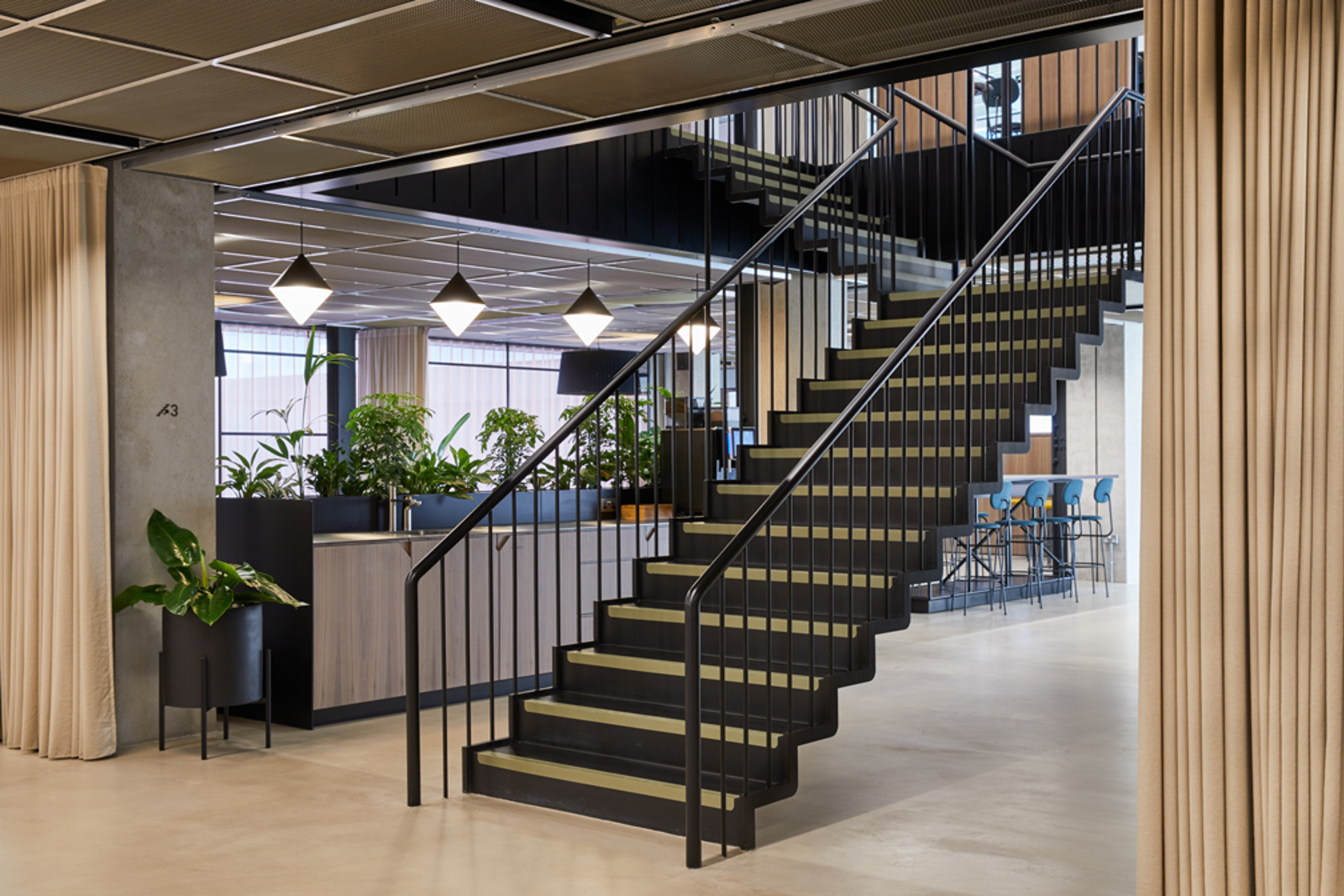 Feature staircase at the centre of reception at MYO Victoria Street